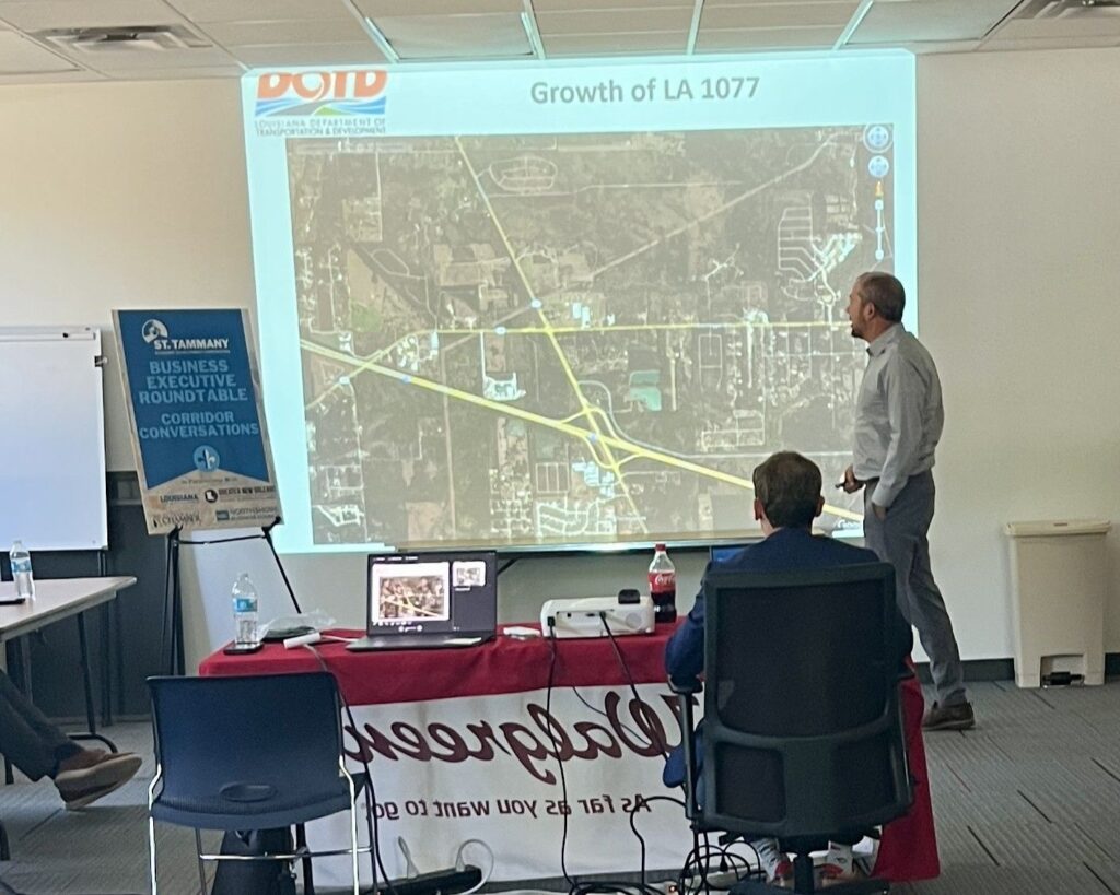 Ryan Hoyt, P.E., with Louisiana DOTD speaking at the Highway 1077 Executive Roundtable.